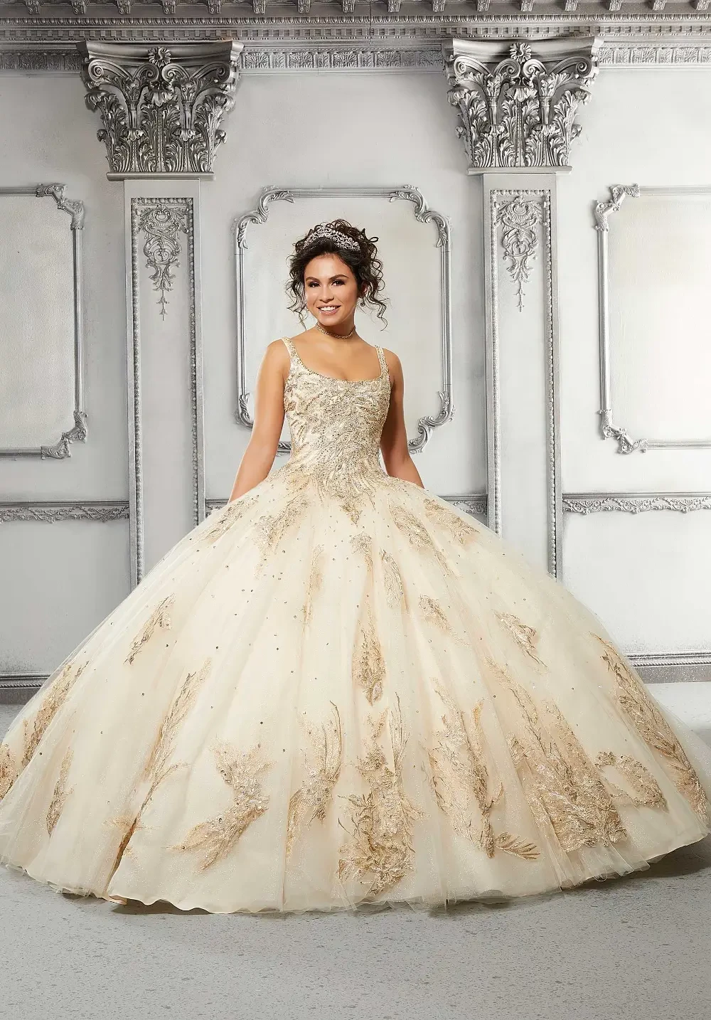 model is wearing a gold quince dress