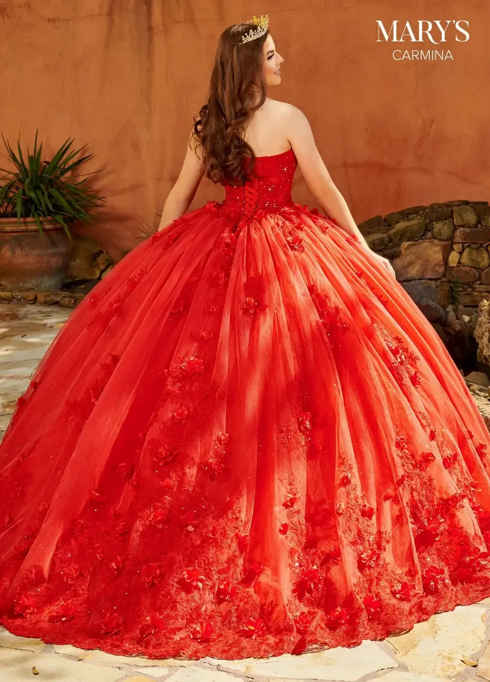 model is wearing a red strapless quince dress
