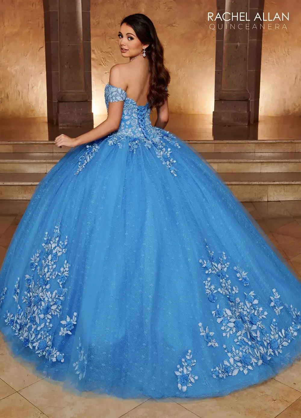 model is wearing an off the shoulder blue quince dress