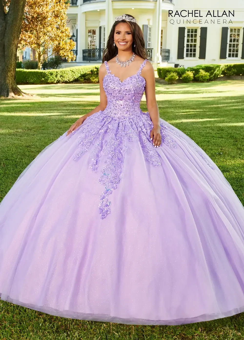 A girl in a lavender ball gown with intricate beading and a full skirt, smiling while standing outdoors.